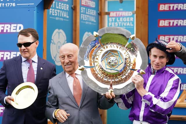 Master: Aidan O'Brien, left, and Ryan Moore, right with Fred Done, founder of Betfred, the sponsor of the St Leger.