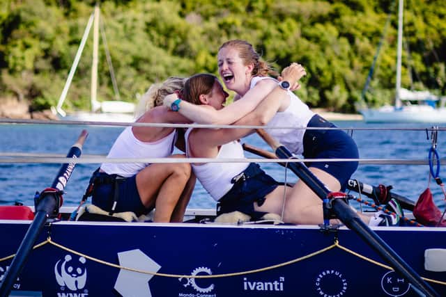 Bobbie Mellor and her Wavebreakers teammates Hatty Carder and Katherine Antrobus passing the finishing line setting a new world record