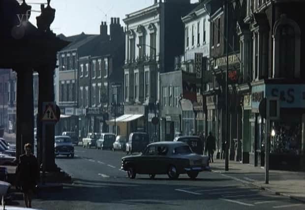 Footage shows the cars and fashions of the town have changed