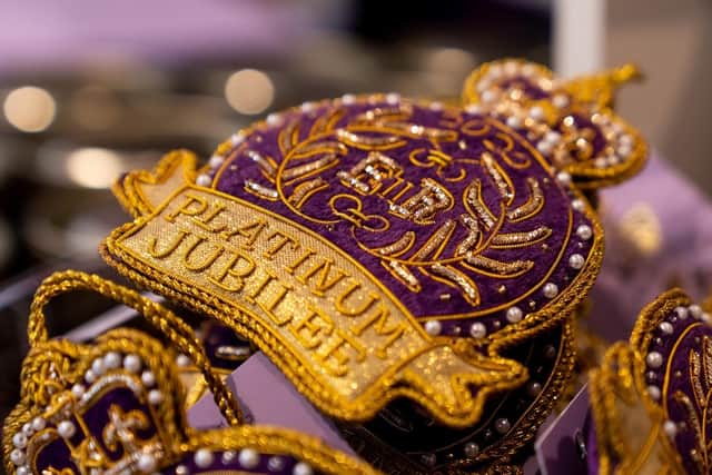 Platinum jubilee merchandise on display at the Buckingham Palace shop. (Pic credit: Ming Yeung / Getty Images)