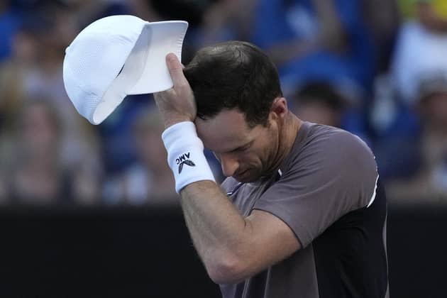 End of the Australian Open story: Andy Murray, a five-time finalist in Melbourne, reacts following his first round loss to Tomas Martin Etcheverry of Argentina on Monday which has left his pondering his future. (AP Photo/Andy Wong)