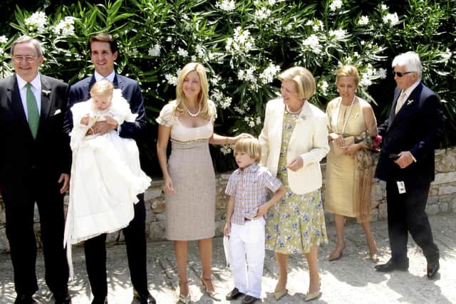 ATHENS, GREECE - JUNE 18: (L-R) Former King Constantine, Crown Prince Pavlos with his christened son, Odysseas-Kimon, his wife Marie-Chantal, their son, Constantine-Alexios, her mother and father Robert Miller pose outside the Agios Ioannis monastery of Kareas June 18 2005 in Athens, Greece. (Photo by Milos Bicanski/Getty Images)