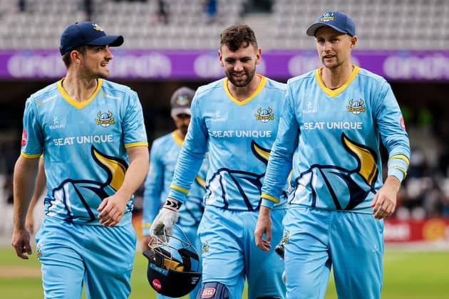 Donovan Ferreira, centre, flanked by Jordan Thompson, left, and Joe Root, right, after Yorkshire had dismissed Worcestershire for 101 on the South African's debut for the county on Thursday. Picture by Alex Whitehead/SWpix.com