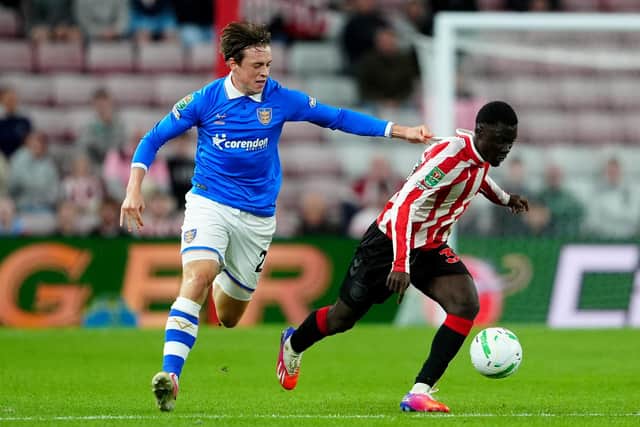 Hull City's Elliot Stroud (left) and Sunderland's Jocelin Ta Bi battle for the ball during the Carabao Cup third round match at the Stadium of Light (Picture: PA)