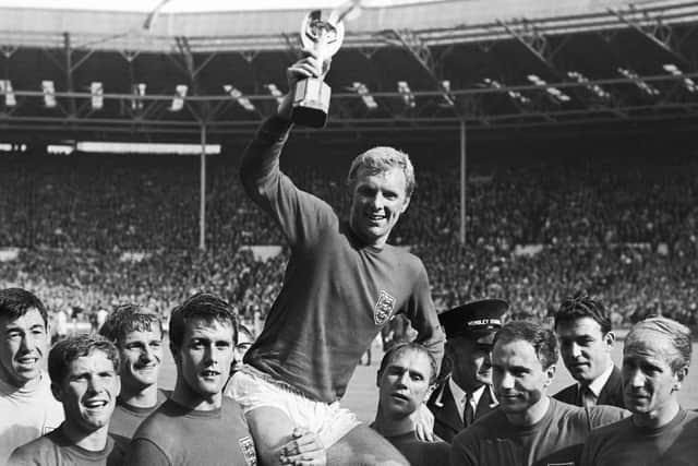 MAGICAL MOMENT: England's soccer team captain Bobby Moore, is carried shoulder high by his teammates holding World Cup at the Wembley Stadium in London, July 30, 1966. From left to right, goalkeeper Gordon Banks, Alan Ball, Roger Hunt, Geoff Hurst, Moore, Ray Wilson, George Cohen and Bobby Charlton. Picture: AP Photo/Bippa, File