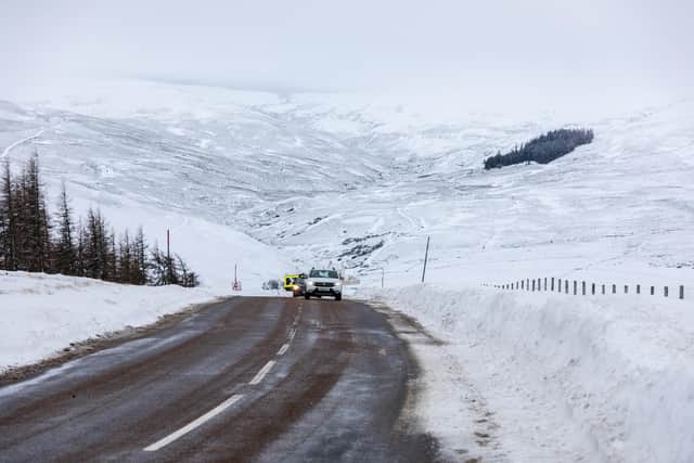 Library image of cars make their way along the A939 after heavy snowfall in the Scottish Highlands in December 2022