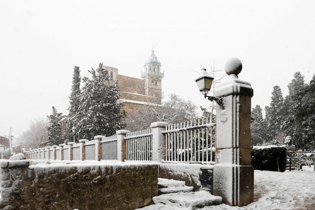Picture shows the Cartoixa de Valdemossa palace in the mountain village of Valldemossa covered in snow on the Spanish Balearic island of Mallorca, on February 27, 2023. (Photo by JAIME REINA/AFP via Getty Images)