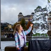 Bella Woodburn, five, admires one of the ice sculptures in City Park