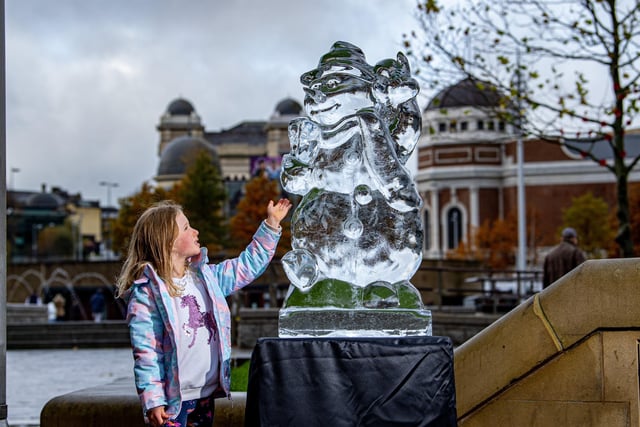 Bella Woodburn, five, admires one of the ice sculptures in City Park