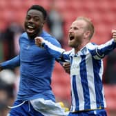 DELIGHT: Barry Bannan (right) celebrates victory with teammate Anthony Musaba
