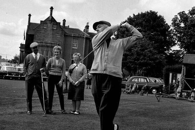 A golfer drives off in the Liberton Mixed foursomes competition, held in aid of Edinburgh Press Charities, in July 1965.