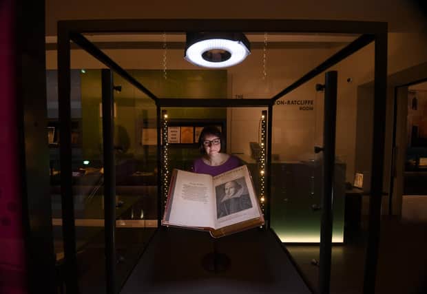 Rhiannon Lawrence-Francis, Special Collections Curator pictured with a book from the Shakespeare First Folios at the Treasures Gallery at Leeds University, Leeds. Picture taken by Yorkshire Post Photographer Simon Hulme 18th April 2023