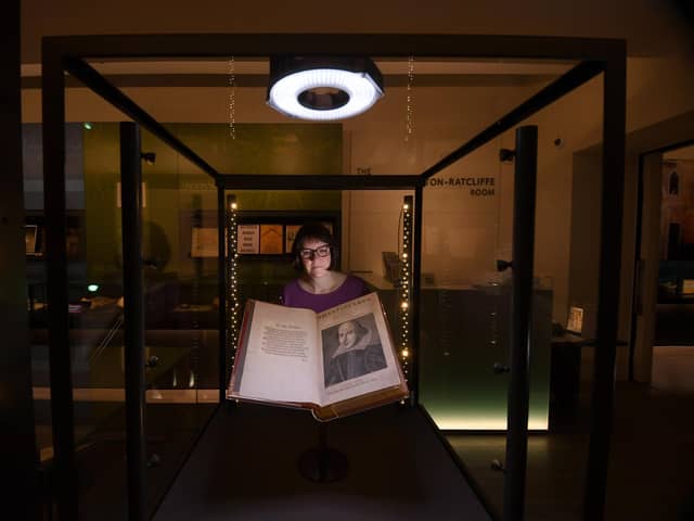 Rhiannon Lawrence-Francis, Special Collections Curator pictured with a book from the Shakespeare First Folios at the Treasures Gallery at Leeds University, Leeds. Picture taken by Yorkshire Post Photographer Simon Hulme 18th April 2023