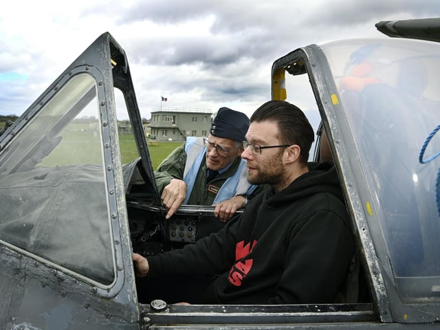 Gary Rooke is shown round a Gannet by volunteer John Best, during the open cockpit event at the Yorkshire Air Museum, near York.