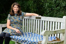Daxa Patel sat on her father's memorial bench in Golden Acre park in Leeds.