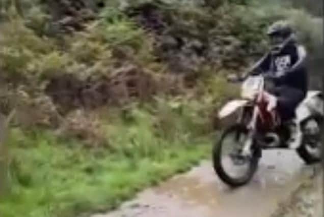 A still of the video released by South Yorkshire Police after a park ranger was assaulted by an off-road biker