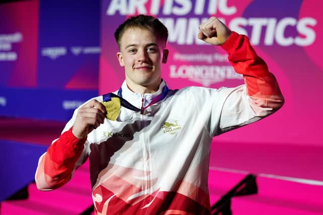 Halifax's Luke Whitehouse celebrates with his gold medal after winning the Men's Floor Exercise final in Glasgow. Picture: Owen Humphreys.