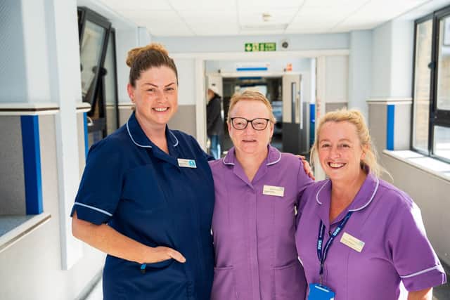 Colleagues Matron Karis Reeve and Senior Sister Tammy Bingham say goodbye to Angela O'Neill (centre).