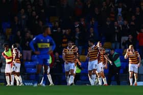 GOOD TIMES: Bradford City's players celebrate the only goal of the game