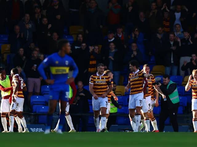 GOOD TIMES: Bradford City's players celebrate the only goal of the game