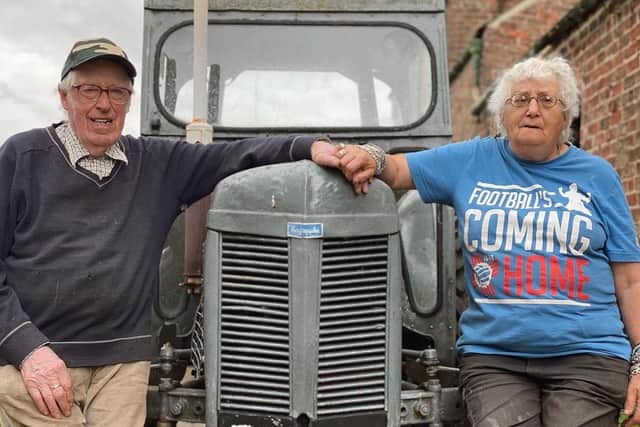 Farmers standing by their tractor on the new series of The Yorkshire Vet. (Pic credit: Channel 5)