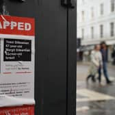 A poster on a telephone exchange box on Charlotte Street in London, showing a couple allegedly kidnapped by Hamas in Gaza amid Israel's siege on the territory. PIC: Jonathan Brady/PA Wire