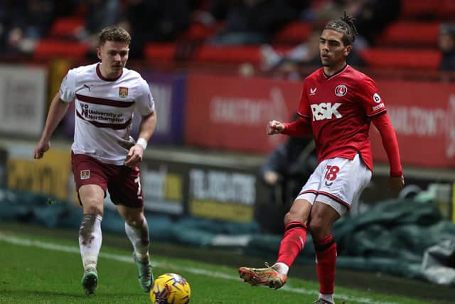 Barnsley defender Tennai Watson, pictured in action for former club Charlton Athletic in January 2024, attempts a pass as Northampton Town opponent Sam Hoskins watches on. Photo by Pete Norton/Getty Images.