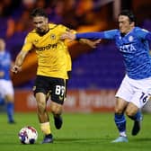 STOCKPORT, ENGLAND - SEPTEMBER 20: Tyler Roberts of Wolverhampton Wanderers is challenged by James Brown of Stockport County during the Papa John's Trophy match between Stockport County and Wolverhampton Wanderers U21 at Edgeley Park on September 20, 2022 in Stockport, England. (Photo by Charlotte Tattersall/Getty Images)