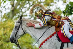 Pictured A member of the Roman cavalry AKA Simon Burrows from Equistry, a mounted display team specialising in re-enactment from early Roman invasion to WW1, leans forward whilst on his display horse Jimbob. Picture By Yorkshire Post Photographer,  James Hardisty.