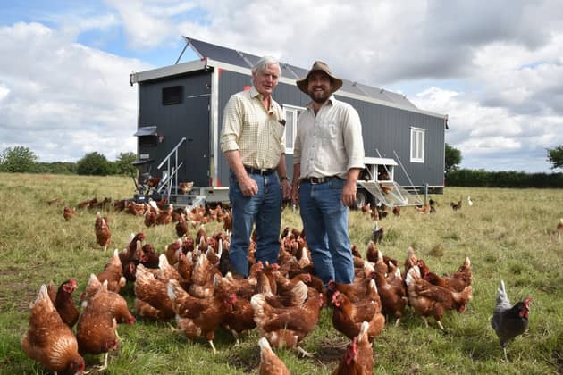 Charles and James Johnson with their pasture-grazed hens at Mallard Grange Farm, near Ripon.