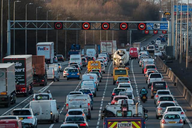 Traffic on smart motorways is monitored by cameras and sensors and managed via active overhead signs