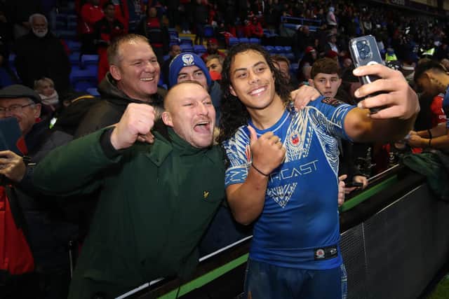Jarome Luai poses for a photo with supporters following the quarter-final against Tonga. (Photo by Jan Kruger/Getty Images for RLWC)
