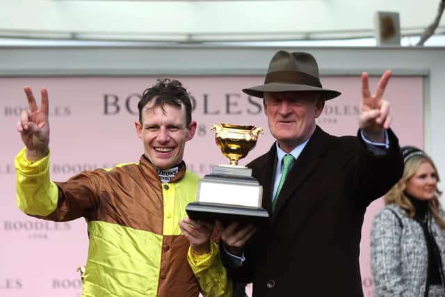 V for Victory: Paul Townend, left, and Willie Mullins celebrate Galopin Des Champs' second Gold Cup win (picture: PA)