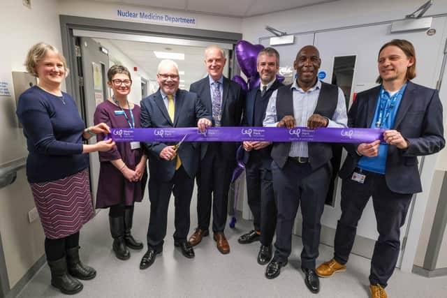 First patient Russell Dickens cuts the ribbon to the new facility (3rd from left) with Consultant Clinical Scientist Anna Hallam, Sheffield Teaching Hospitals Chief Executive Kirsten Major, Consultant Clinical Oncologist Professor Jonathan Wadsley, South Yorkshire’s Mayor Oliver Coppard, Uriah Rennie and Technical Manager Adam Pickles.