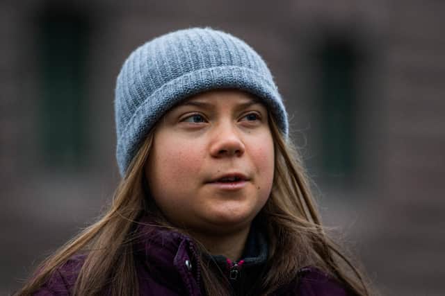 Swedish climate activist Greta Thunberg  pictured as she protests in front of the Swedish Parliament (Riksdagen) in Stockholm, on November 19, 2021. Photo by JONATHAN NACKSTRAND/AFP via Getty Images.