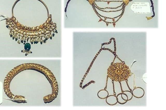 The jewellery, which was in an exhibit of Indian artefacts, is said to be of 'historical significance.' SWNS