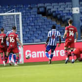 DECISIVE MOMENT: Preston North End's Liam Lindsay loses his Sheffield Wednesday markers to score the game's only goal
