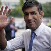 Prime Minister Rishi Sunak walks to his hotel on the first day of the Conservative Part Conference in Manchester
