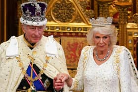 King Charles III, wearing the Imperial State Crown and the Robe of State, and Britain's Queen Camilla, wearing the George IV State Diadem, leave after he read the King's Speech in the House of Lords chamber, during the State Opening of Parliament.