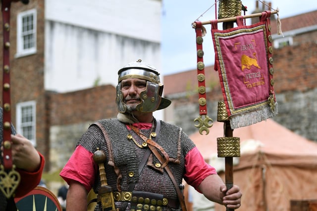 A man dressed up in Roman suit and armour.