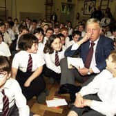 TV star Michael Parkinson visits a school in the small village of Shafton, Barnsley, and reads extracts from William Fordes book 'Tales from the Allotments', March 15, 2000