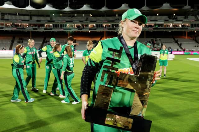 Anya Shrubsole heads into retirement with the big "H" as she carries the Hundred trophy following Northern Superchargers defeat to Southern Brave at Lord's. Photo by Julian Finney/Getty Images.