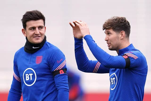 PARTNERS: England's Harry Maguire and John Stones (right) during a training session at St George's Park Picture: Nick Potts/PA