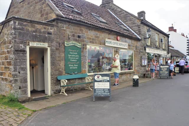 There’s a constant flow of people nipping into the busy village shop to buy gifts, outdoor clothing, treats or to stop for coffee