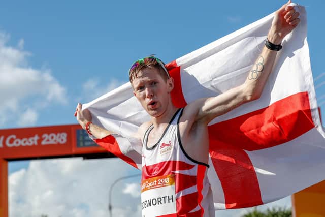 England's Tom Bosworth (silver) poses with his flag after the athletics men's 20m race walk final during the 2018 Gold Coast Commonwealth Games on the Gold Coast (Picture: ADRIAN DENNIS/AFP via Getty Images)