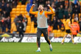 DELIGHT: Unused Leeds United substitute Liam Cooper celebrates after the final whistle at Molineux