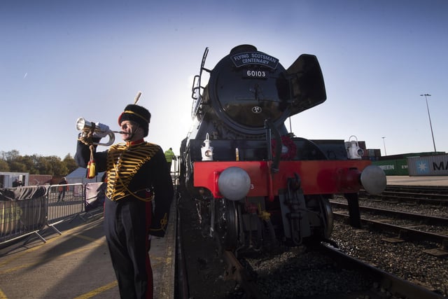 Crowds welcome back the Flying Scotsman back to Doncaster,  Freightliner Railport, Decoy Bank South, Doncaster. Robert Crick plays the Last Post in front of the Scotsman to maek Remembrance Day. Picture taken by Yorkshire Post Photographer Simon Hulme