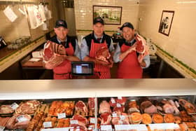 Matt Slack  (centre) pictured with his brothers Luke (left) and Tom in the butchers shop
