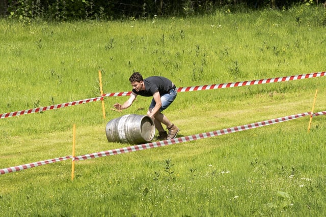 Competitors take part in the Barrel Push at Finghall. Picture taken by Yorkshire Post Photographer Simon Hulme 29th May 2023










