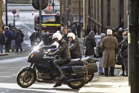 Motorcycle outriders take part in a recreation of Queen Elizabeth and Prince Philip's 1994 state visit to Russia during filming for series five of Netflix's The Crown in the Little Germany district of Bradford. The series is due to air from November 2022. Picture taken on Friday 25 February 2022. Copyright: Guzelian Credit: Asadour Guzelian